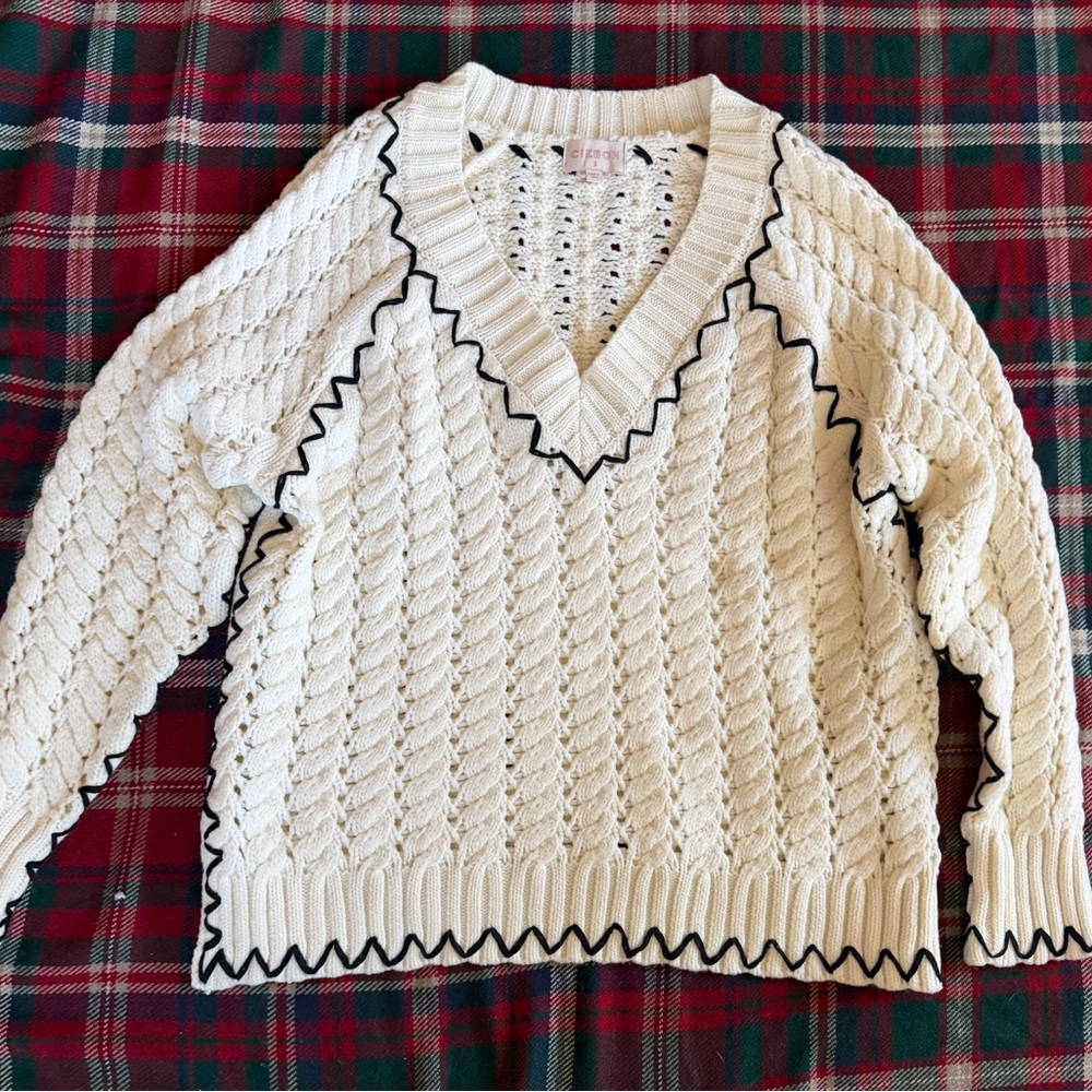 Elegant V-Neck Cable Knit Sweater with Black Accents